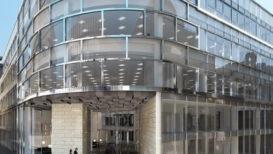 Curved glass office facade and entrance of 71 Queen Victoria Street, London