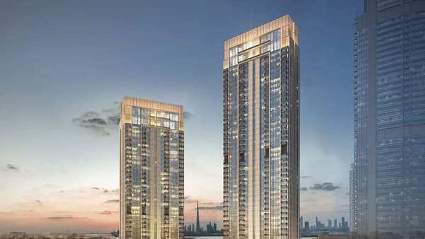 Twin residential towers of Dubai Creek Horizon at dusk